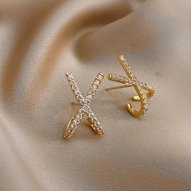 Elplis zircon X stud earrings , 18k gold plated.