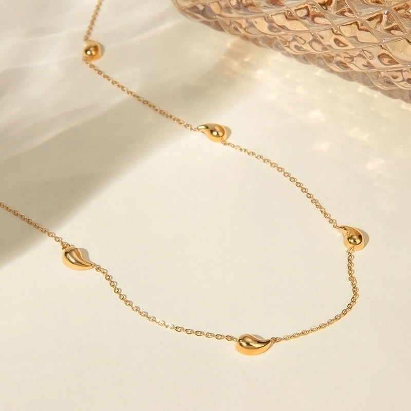 Minimalist water droplet necklace, 18k gold plated.