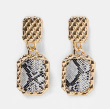 Gold snake print statement earrings